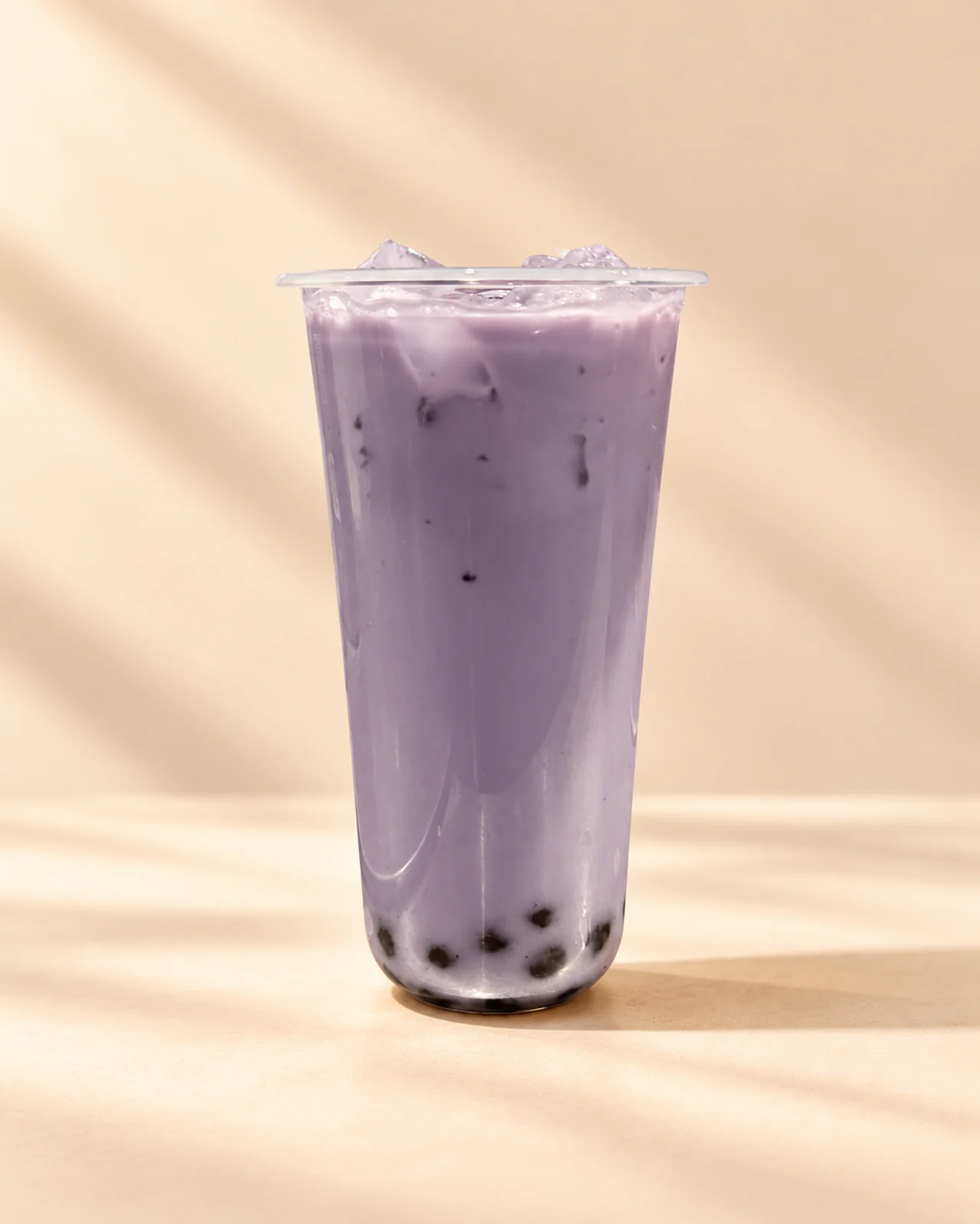 Saha’s purple taro milk tea with ice and boba, photographed by Ahmad